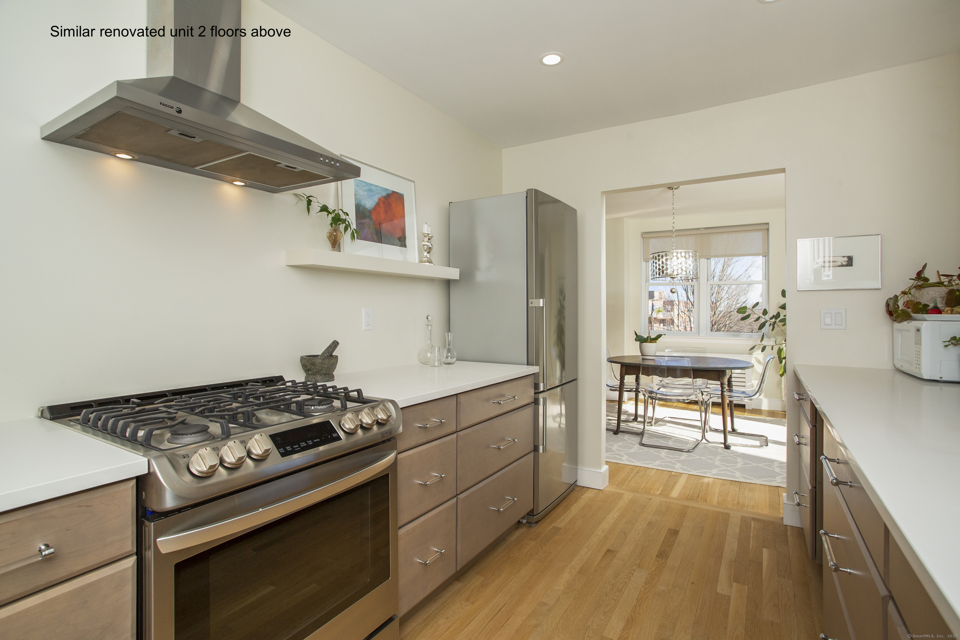4 Putnam Hill, Unit 1C Greenwich, CT 06830 - Photo 9 of 29 a kitchen with stainless steel appliances granite countertop a stove and a sink