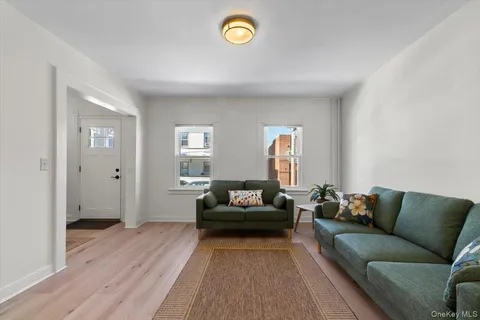 a living room with furniture and a rug