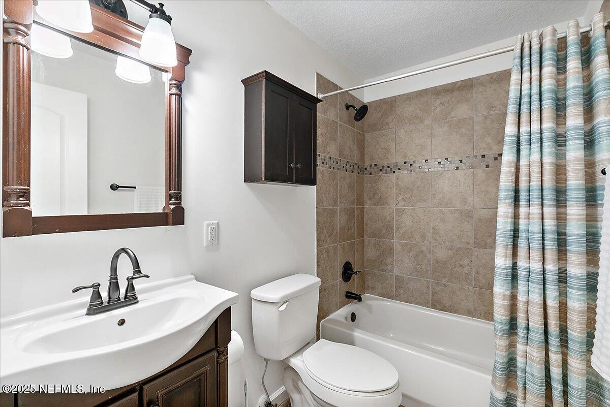 1879 George Street Atlantic Beach, FL 32233 - Photo 12 of 27 a bathroom with a sink toilet and shower