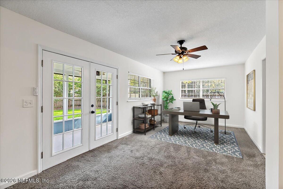 1879 George Street Atlantic Beach, FL 32233 - Photo 15 of 27 a living room with furniture and a window