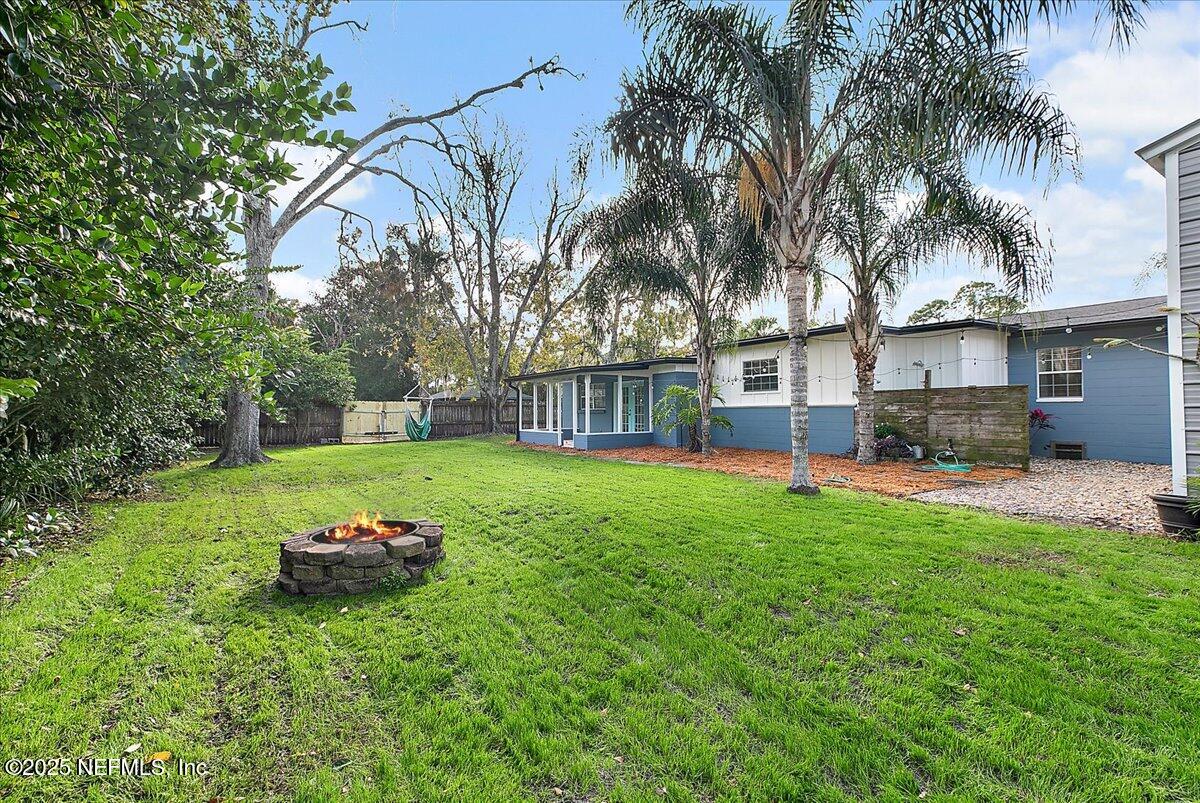 1879 George Street Atlantic Beach, FL 32233 - Photo 21 of 27 a front view of a house with backyard and sitting area