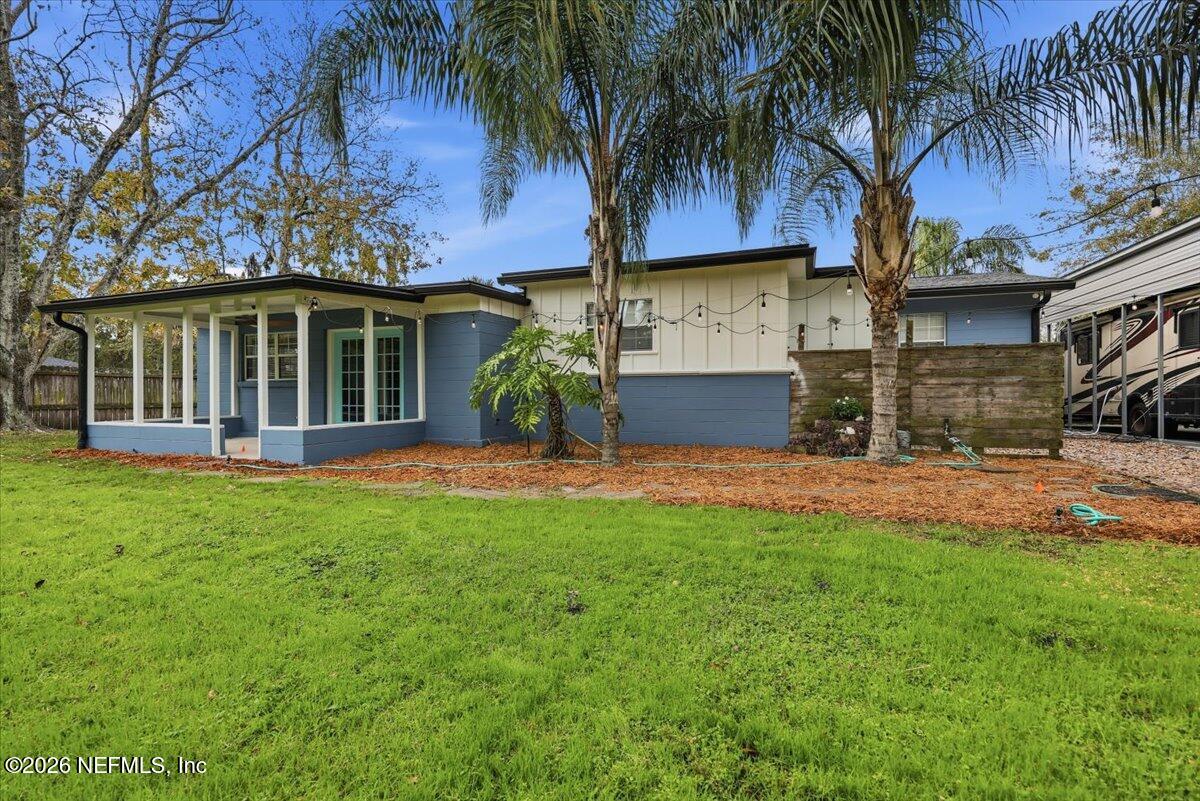 1879 George Street Atlantic Beach, FL 32233 - Photo 26 of 27 a front view of house with yard and green space