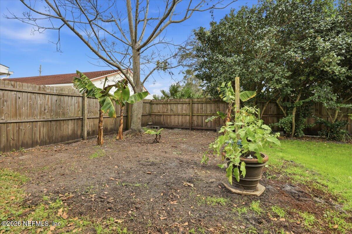 1879 George Street Atlantic Beach, FL 32233 - Photo 27 of 27 a backyard of a house with lots of green space
