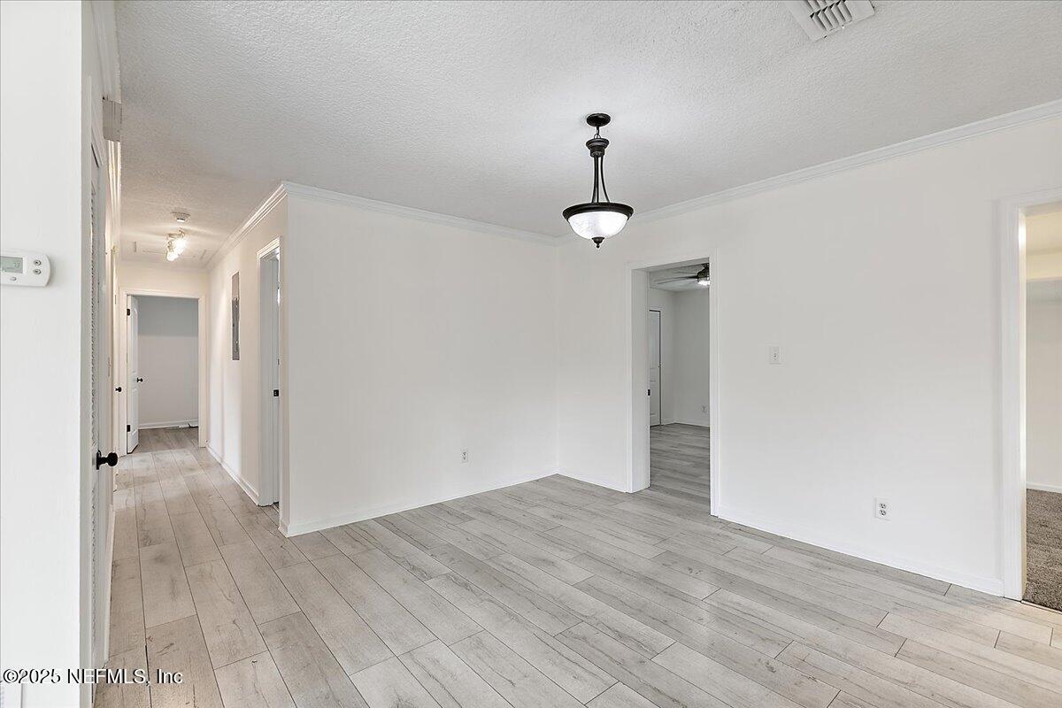 1879 George Street Atlantic Beach, FL 32233 - Photo 5 of 27 a view of empty room with wooden floor