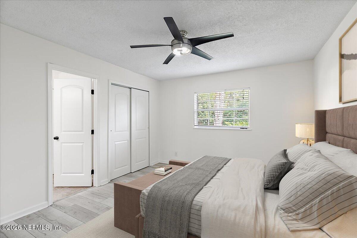 1879 George Street Atlantic Beach, FL 32233 - Photo 8 of 27 a bedroom with a large bed and a window