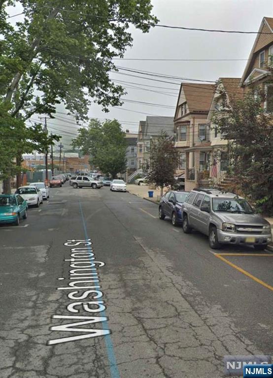 44 Washington Street, Unit 3F Harrison, NJ 07029 - Photo 3 of 5 a view of a street with cars
