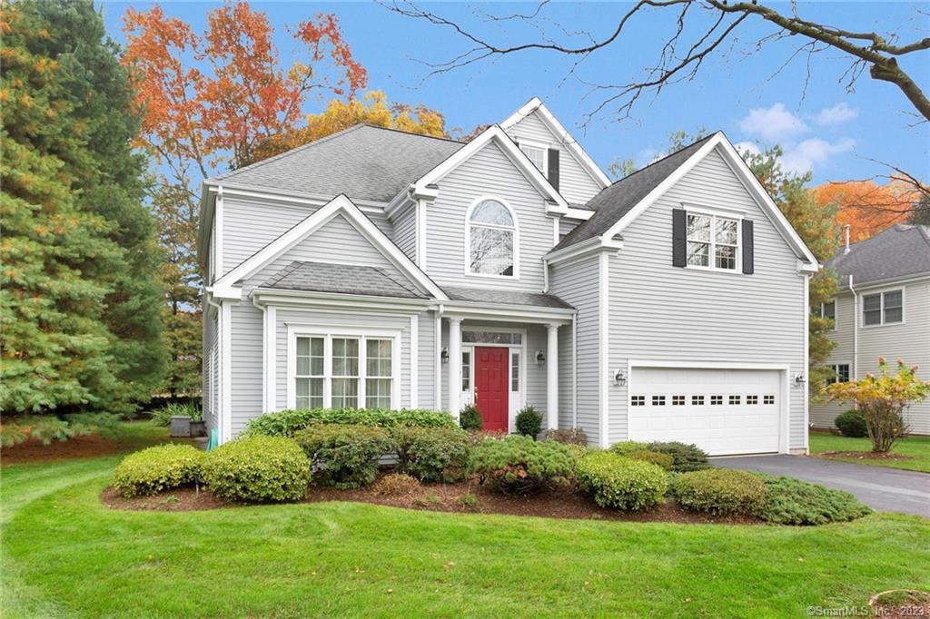 5 Highmeadow, Unit 5 Norwalk, CT 06854 - Photo 1 of 1 a view of a white house next to a yard and large trees