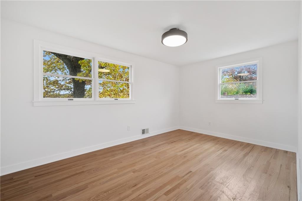 107 Marlboro Road Pittsburgh, PA 15238 - Photo 23 of 45 a view of empty room with wooden floor and fan