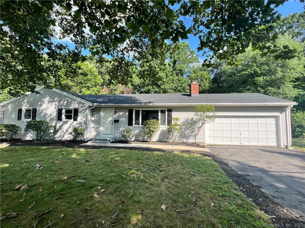 65 Luanne Road Stratford, CT 06614 - Photo 1 of 1 a front view of house with yard and green space