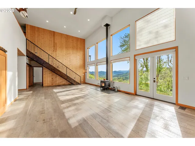 a view of an entryway with wooden floor