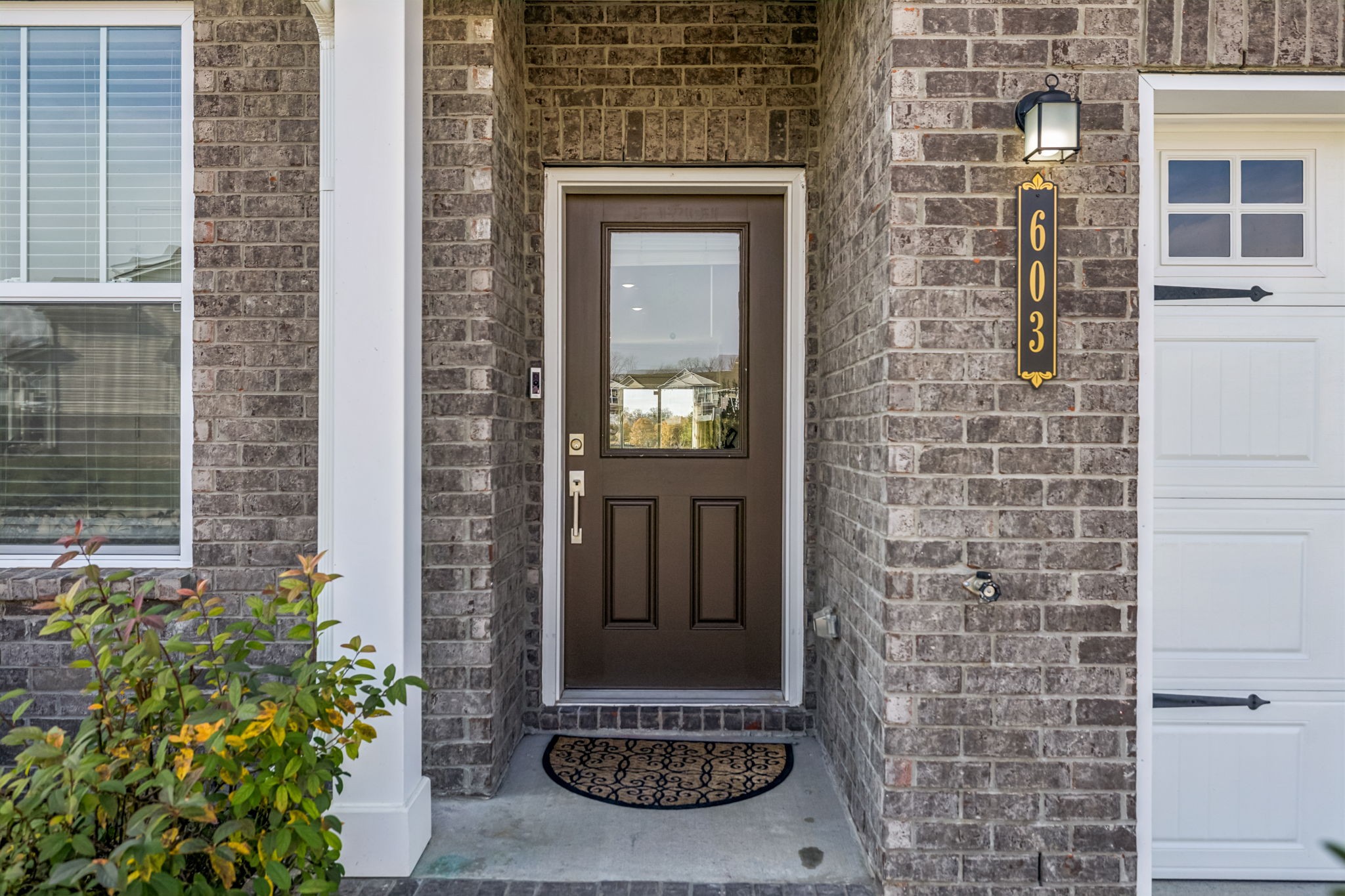 603 Birdie Dr Spring Hill Spring Hill, TN 37174 - Photo 3 of 26 a view of a door of a house with potted plants