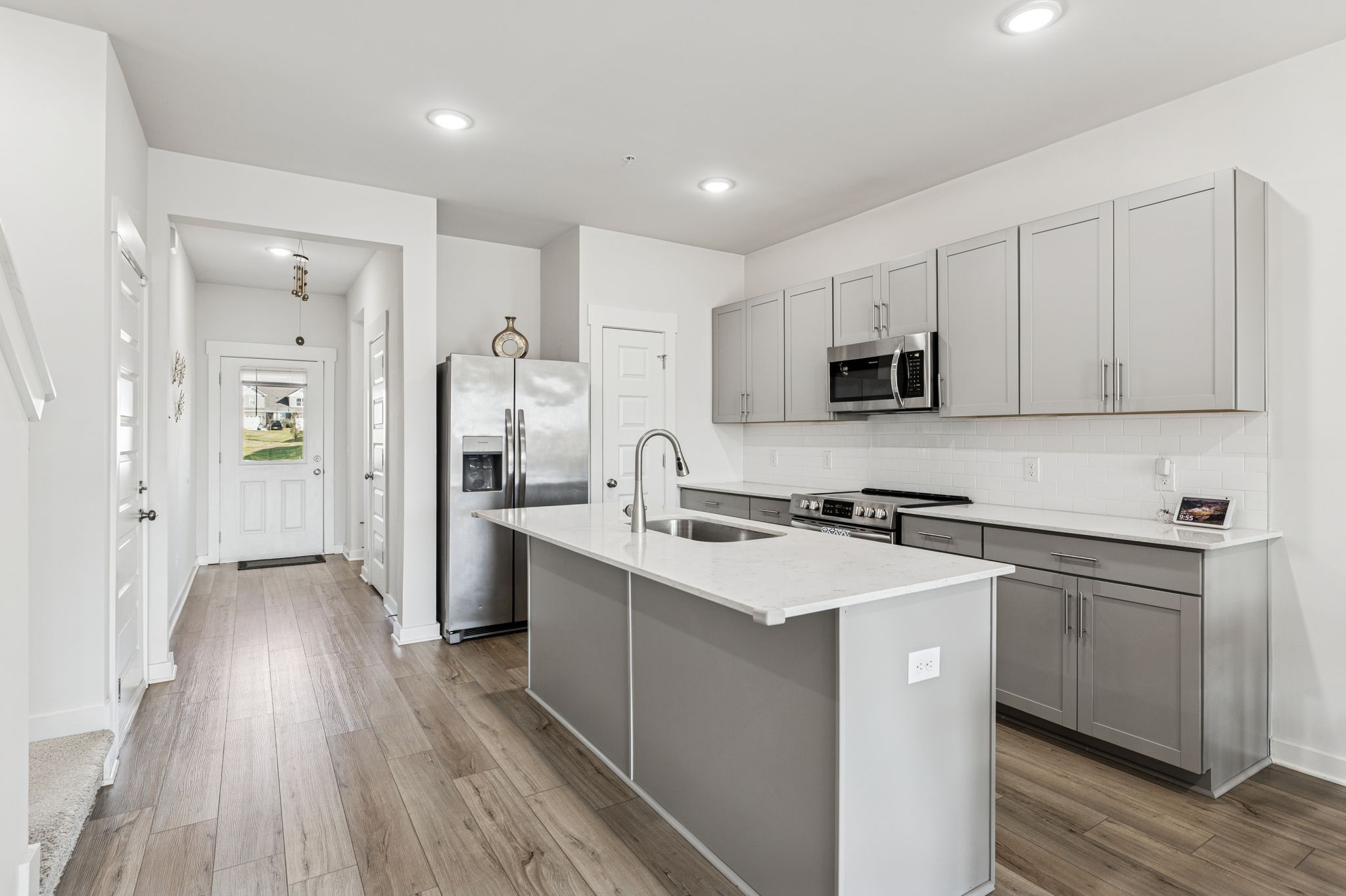 603 Birdie Dr Spring Hill Spring Hill, TN 37174 - Photo 5 of 26 a kitchen with a sink stove and refrigerator