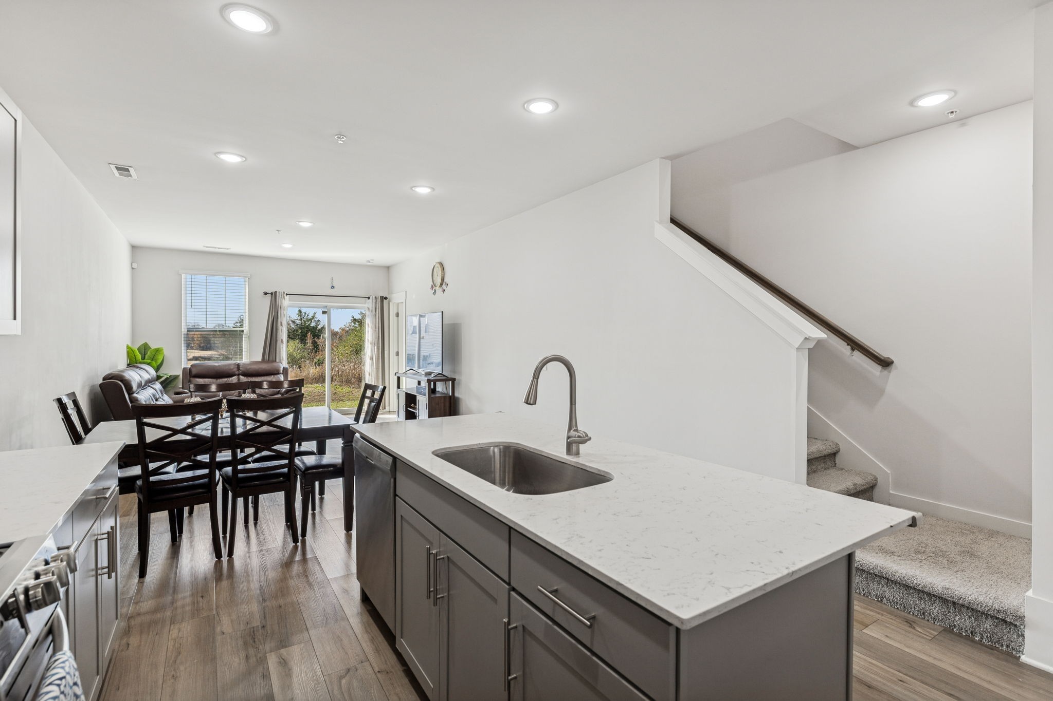 603 Birdie Dr Spring Hill Spring Hill, TN 37174 - Photo 8 of 26 a kitchen with a table chairs and wooden floor