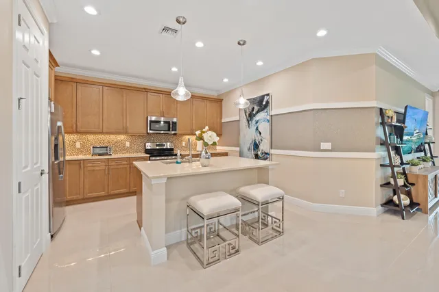 a kitchen with a sink cabinets and window