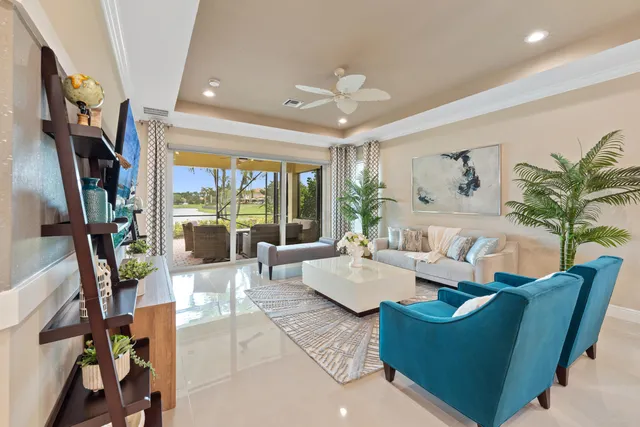 a living room with furniture large window and flat screen tv