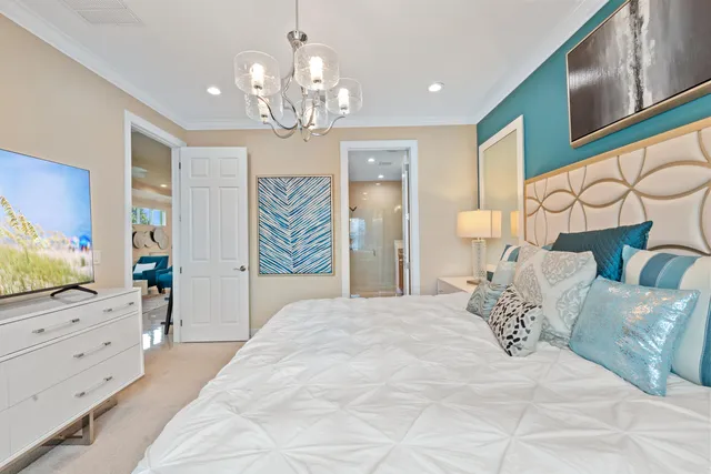 a spacious bedroom with a large bed and a flat tv screen on dresser