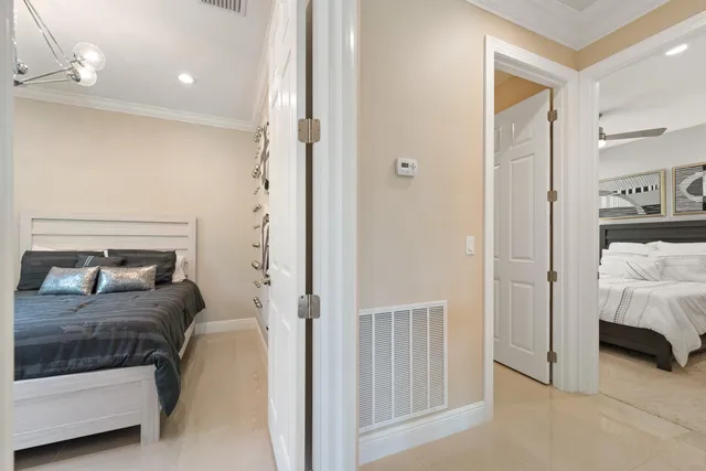 a bedroom with a bed and a couch