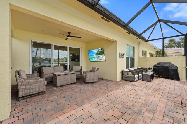 a bedroom with furniture and a large window