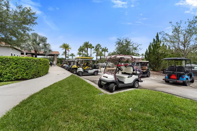 a view of a backyard with lawn chairs and a fire pit