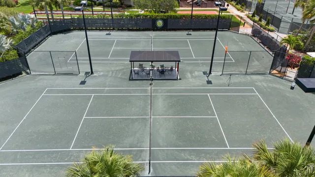 an aerial view of swimming pool with outdoor seating and city view
