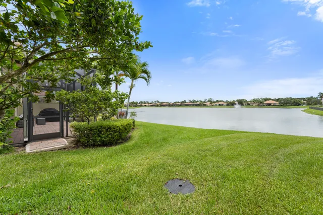 a view of a lake with houses in the back
