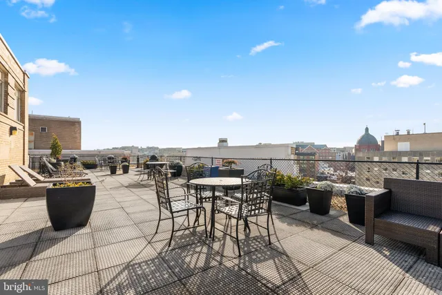 a view of a terrace with furniture and stove