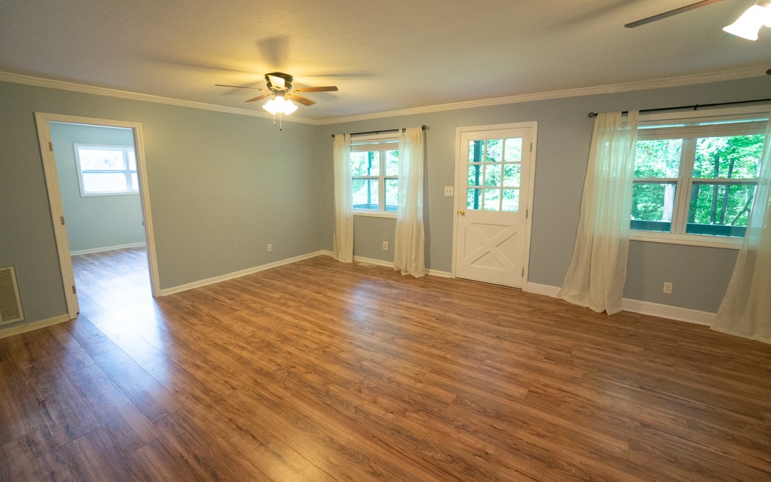145 Fortenberry Road Blairsville, GA 30512 - Photo 3 of 4 a view of an empty room with wooden floor and a window