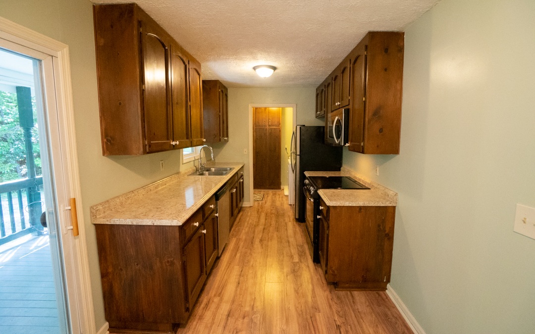 145 Fortenberry Road Blairsville, GA 30512 - Photo 4 of 4 a kitchen with stainless steel appliances granite countertop a refrigerator a stove and a wooden floors
