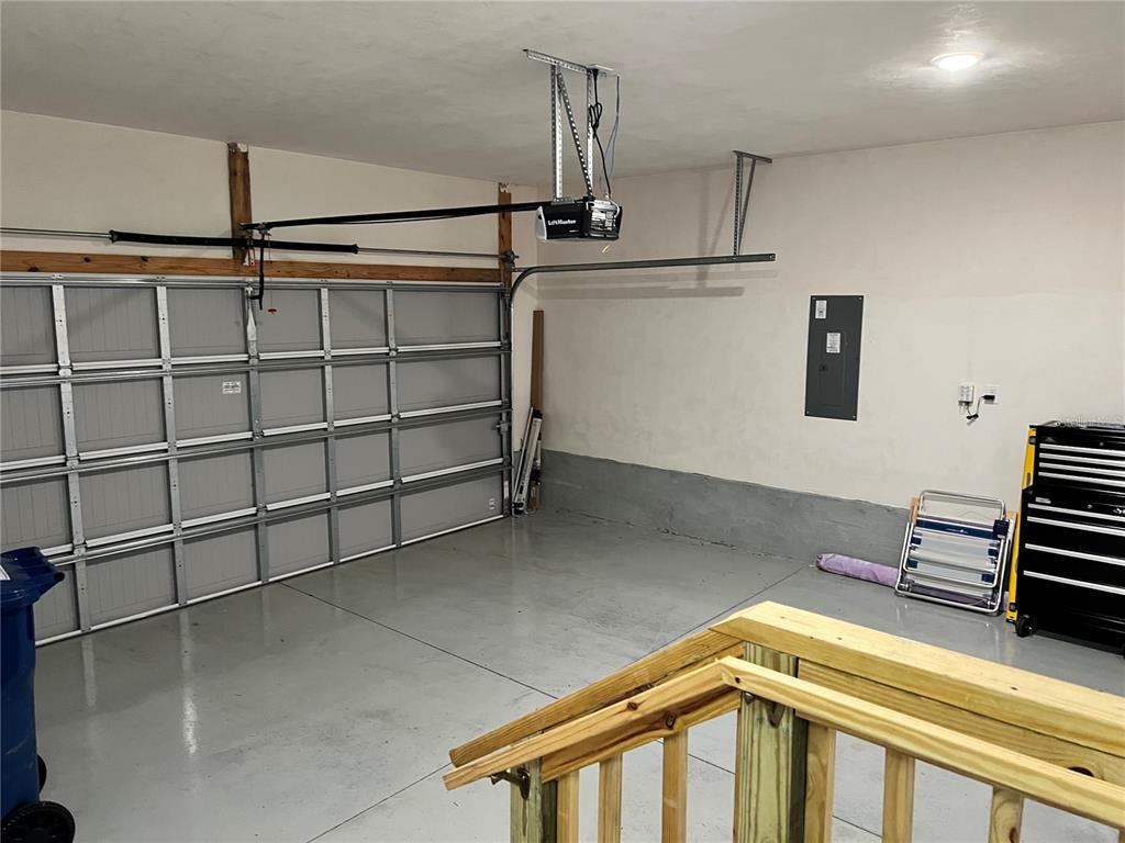 25107 Southwest 9th Lane Newberry, FL 32669 - Photo 7 of 9 a front view of a house with a garage