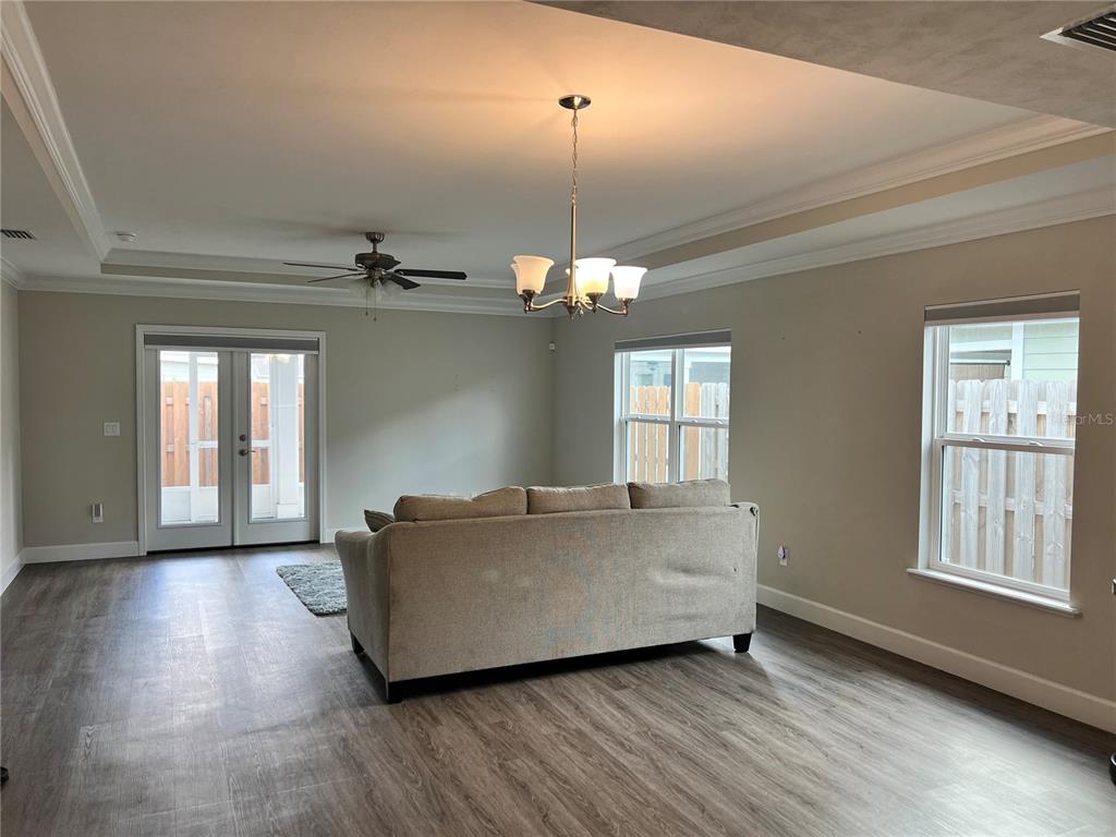 25107 Southwest 9th Lane Newberry, FL 32669 - Photo 8 of 9 a living room with couches and chandelier