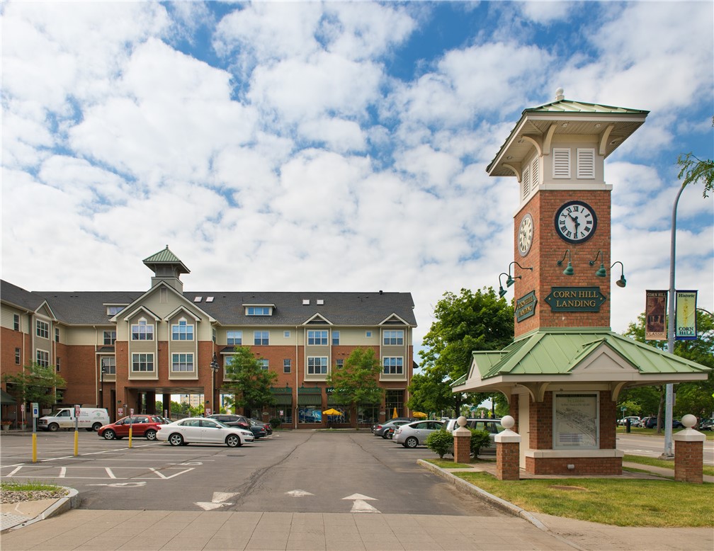 270 Exchange Boulevard, Unit 238 Rochester, NY 14608 - Photo 14 of 15 Exterior of Corn Hill Landing with view of clock t
