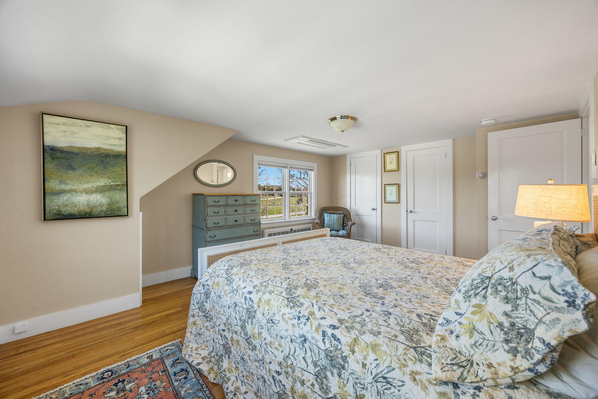 58 Stepping Stones Road Chatham, MA 02633 - Photo 22 of 52 a bedroom with a bed and a lamp on dresser