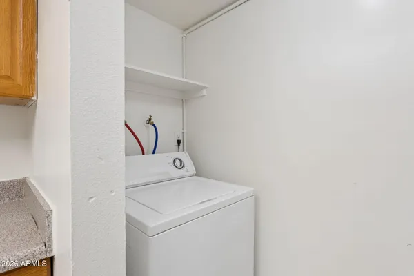 a kitchen with a sink cabinets and a stove