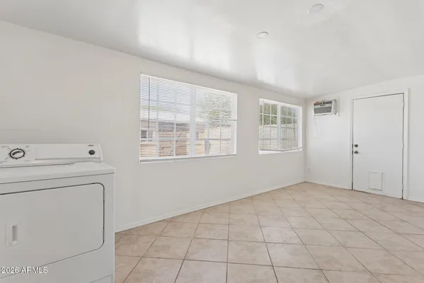 a view of livingroom with washer and dryer