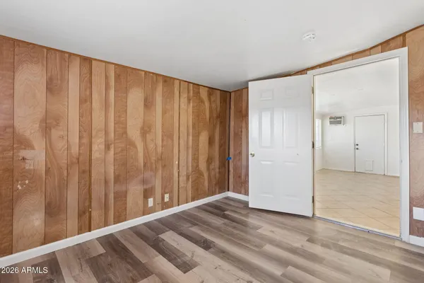 a view of a room with wooden walls