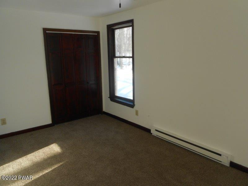 126 Maple Ridge Drive Hawley, PA 18428 - Photo 19 of 40 an empty room with windows