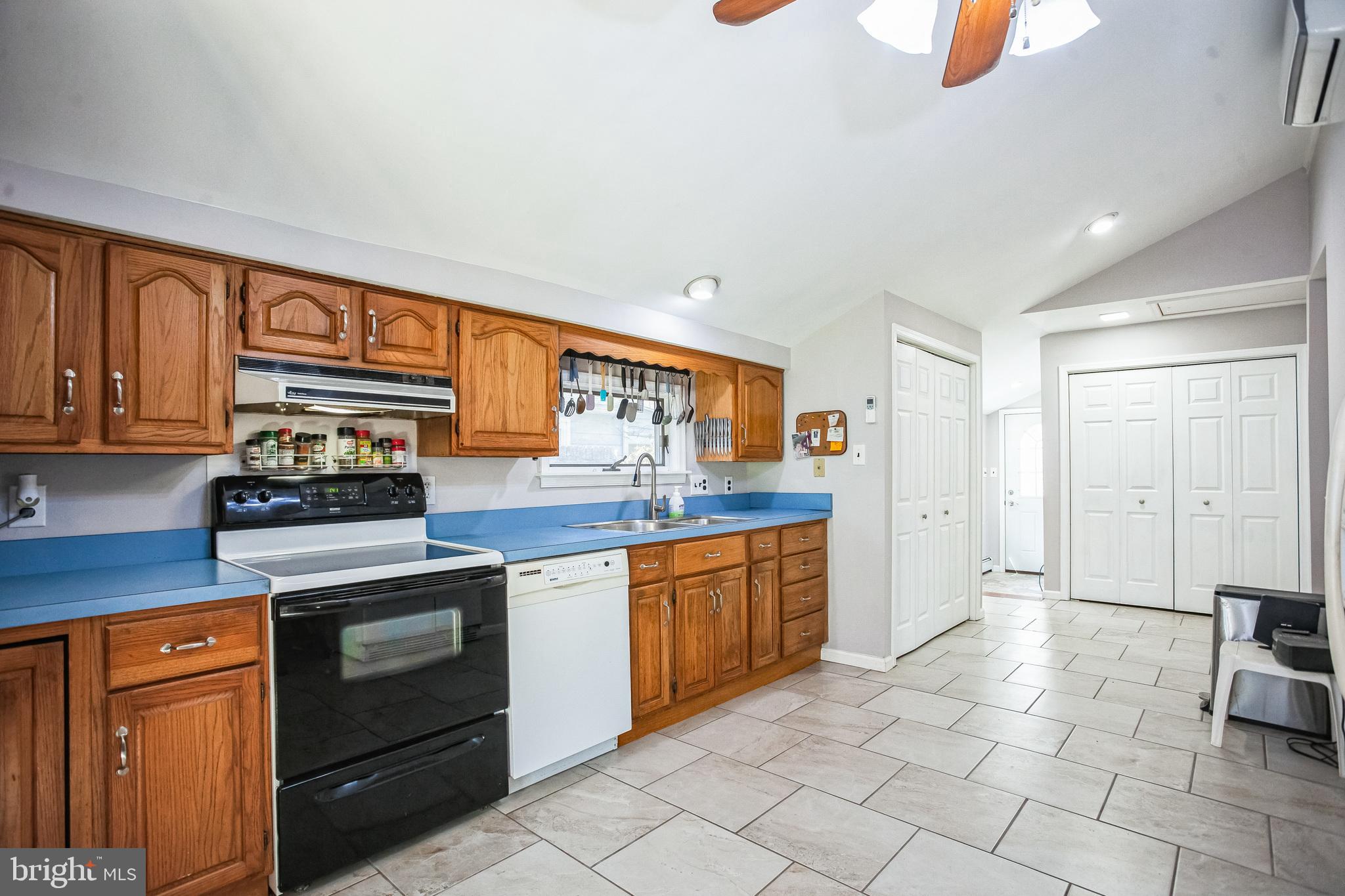 2775 Valley Road Jamison, PA 18929 - Photo 16 of 40 a kitchen with stainless steel appliances granite countertop a stove a sink and a refrigerator