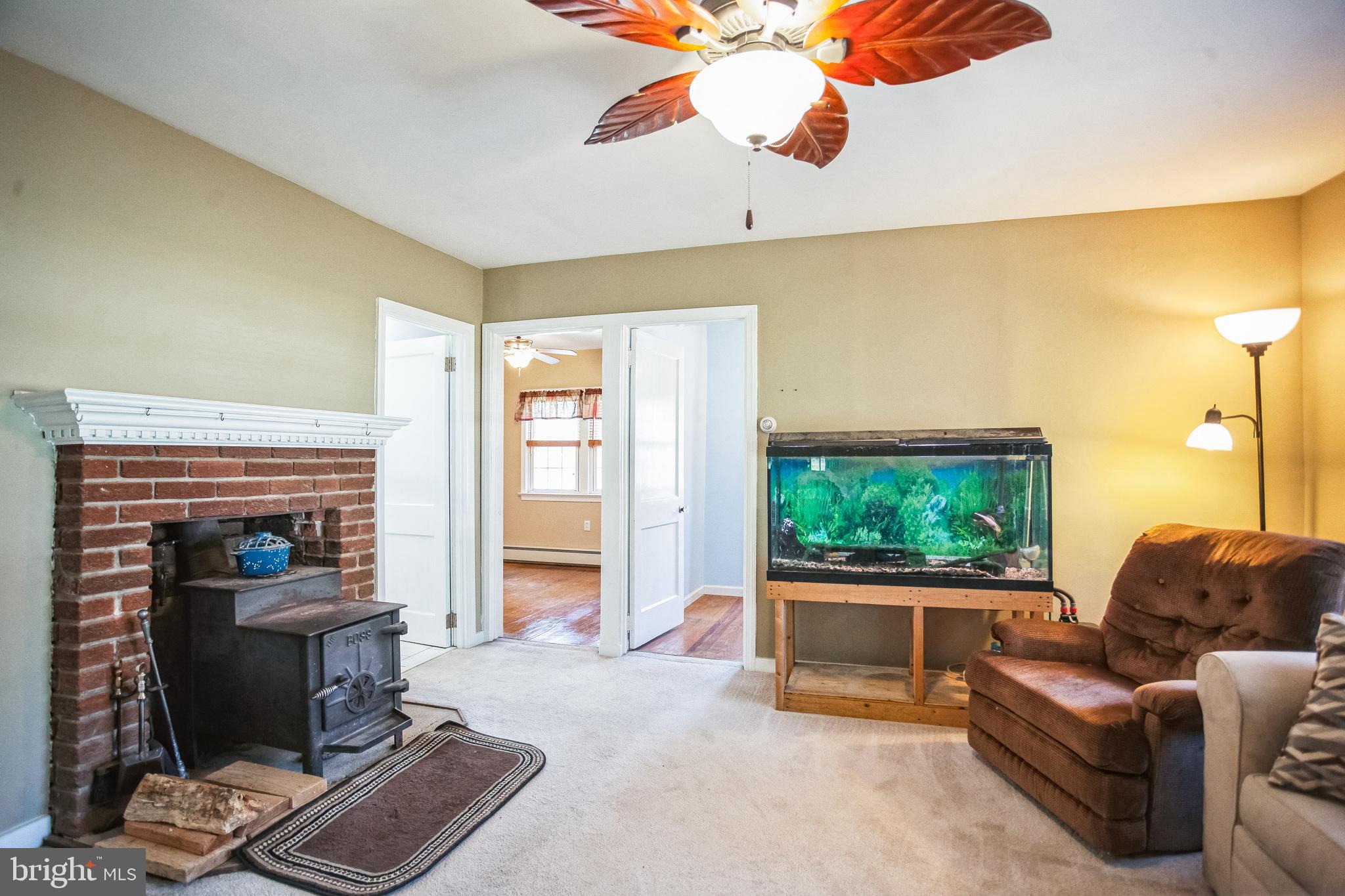 2775 Valley Road Jamison, PA 18929 - Photo 21 of 40 a living room with furniture and a fireplace