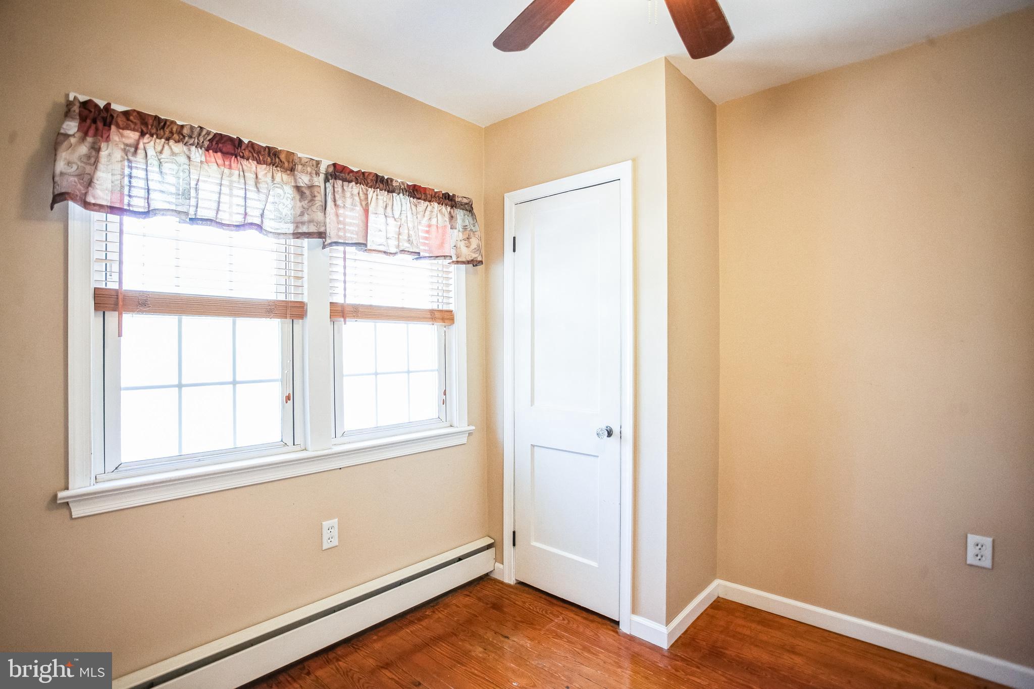 2775 Valley Road Jamison, PA 18929 - Photo 32 of 40 an empty room with wooden floor and windows