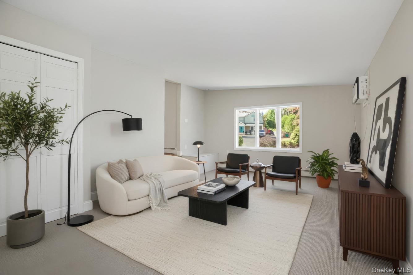 225 Lyman Road East Patchogue, NY 11772 - Photo 11 of 18 Large Family Room with carpet floors