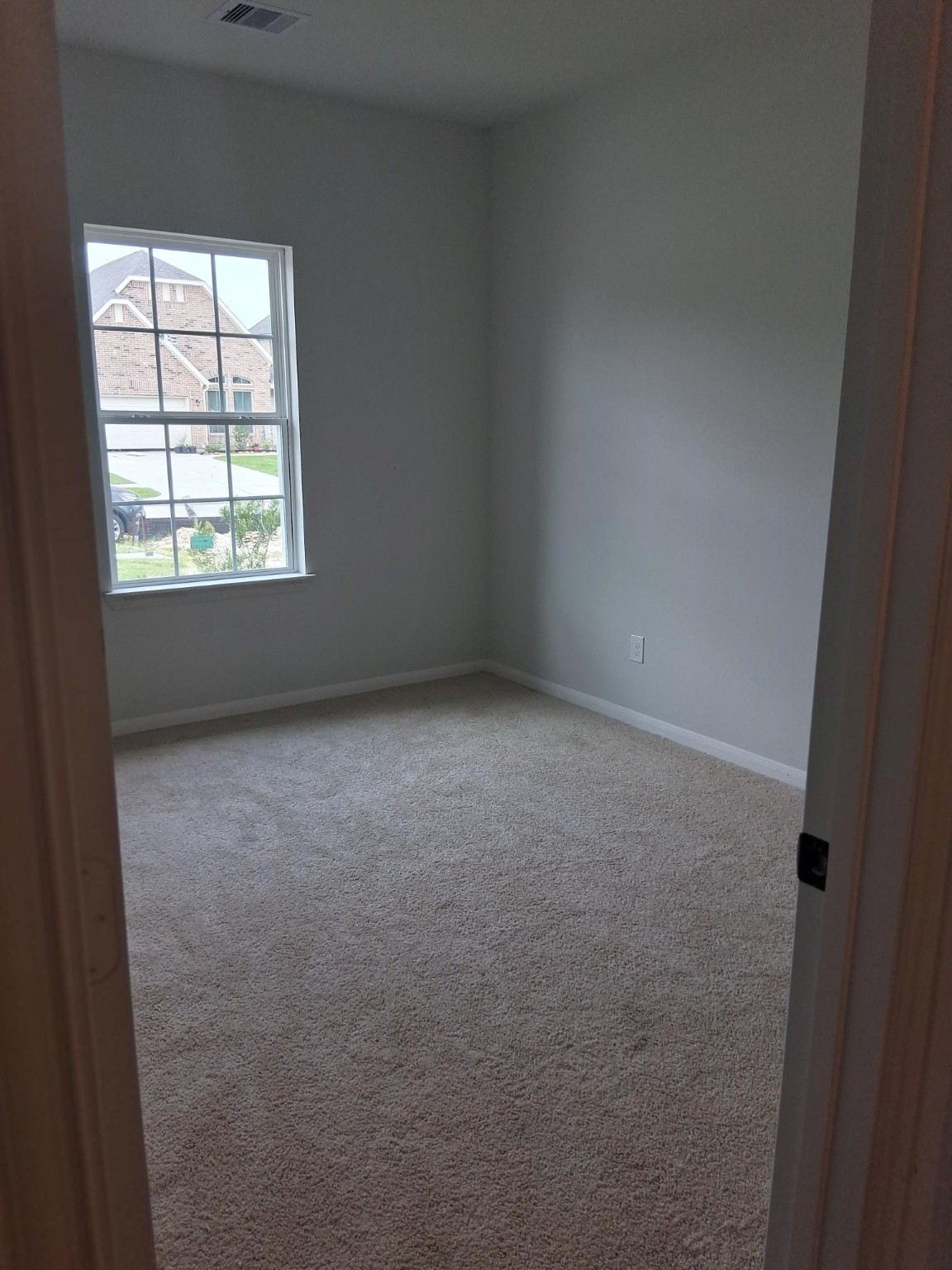 1926 Middle Pass Lane Angleton, TX 77515 - Photo 19 of 22 an empty room with a window