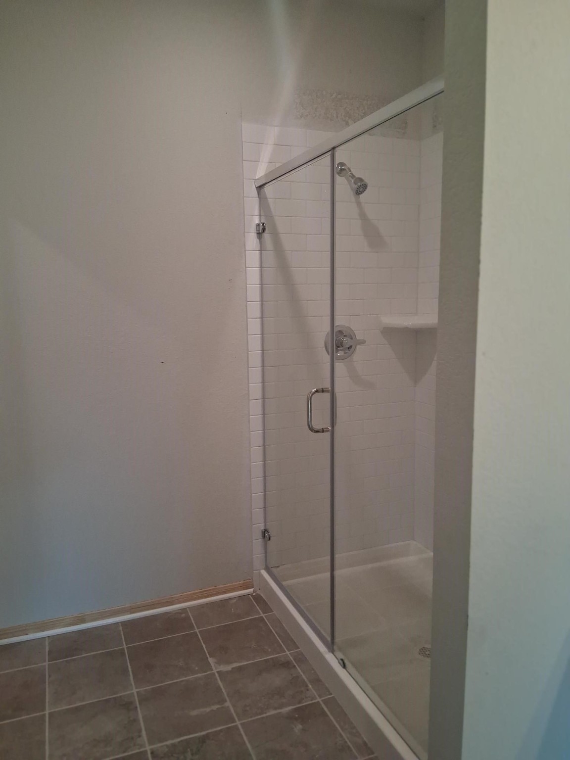 1926 Middle Pass Lane Angleton, TX 77515 - Photo 9 of 22 a bathroom with a glass shower door