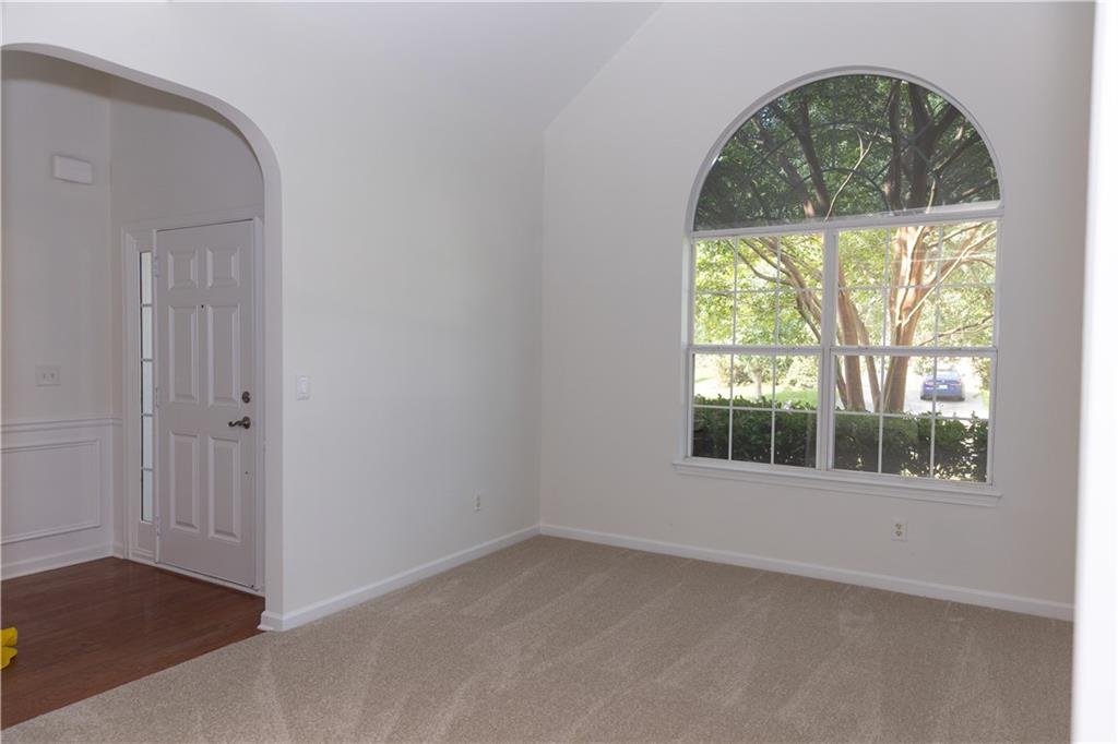 502 Streamside Place Canton, GA 30115 - Photo 4 of 33 an empty room with a window