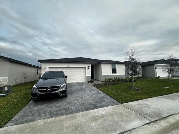 a car parked in front of a house