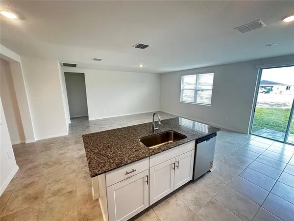 a kitchen with granite countertop a sink and a granite counter tops