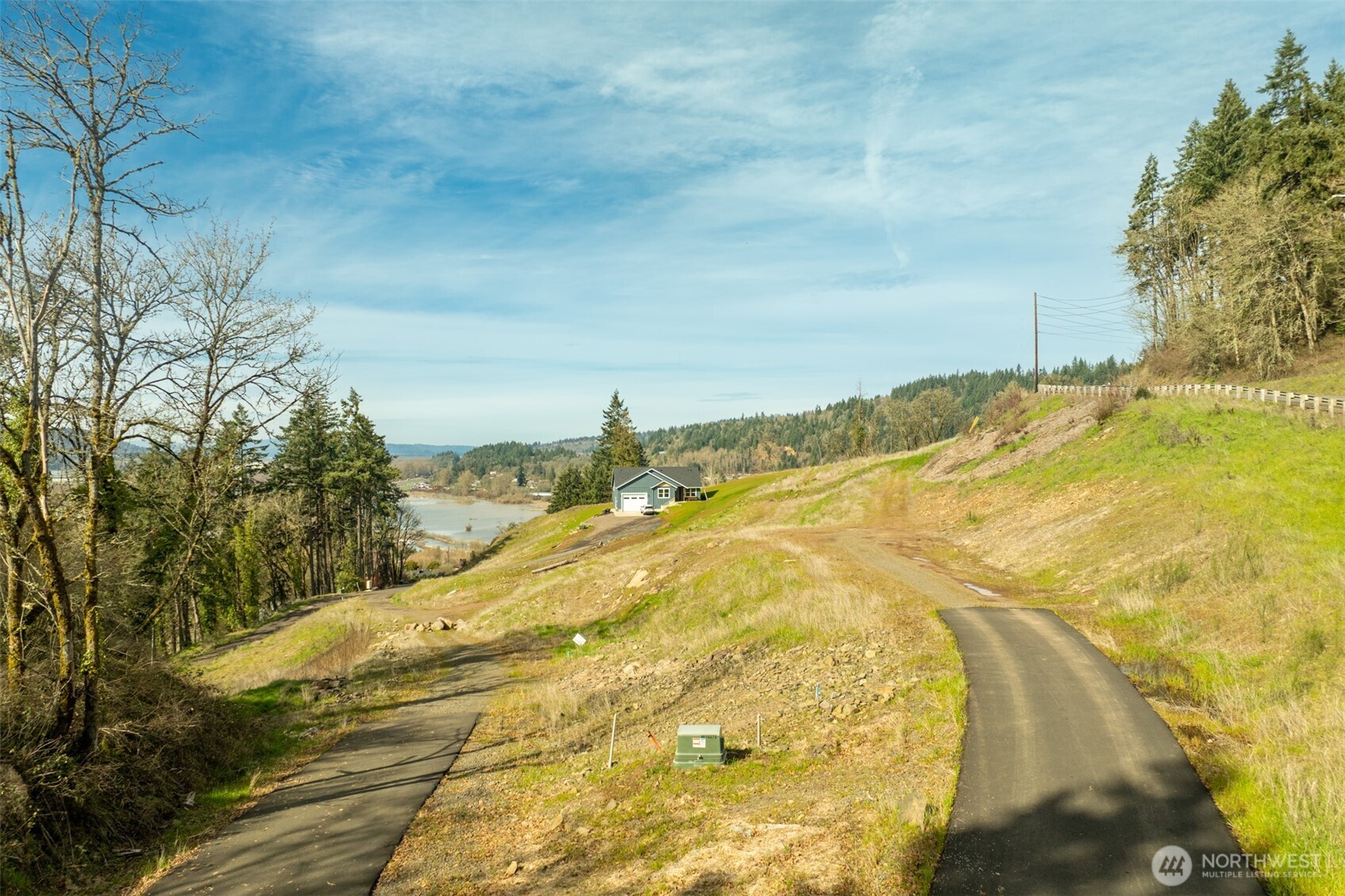 0 Spencer Creek Road, Unit LOT 1 Kalama, WA 98625 - Photo 17 of 31 a view of a swimming pool with an outdoor space and seating area