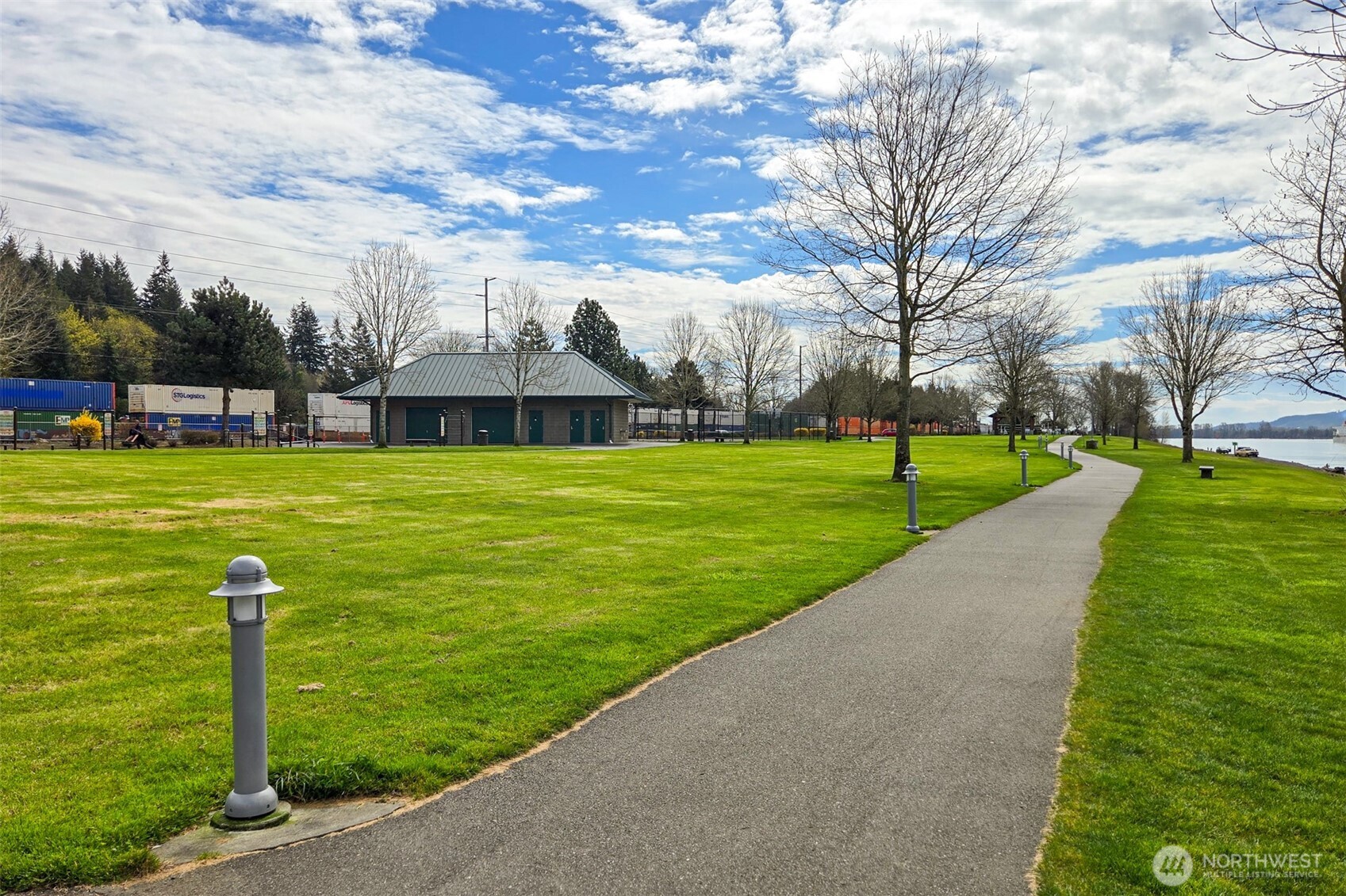 0 Spencer Creek Road, Unit LOT 1 Kalama, WA 98625 - Photo 24 of 31 a view of a house with a swimming pool
