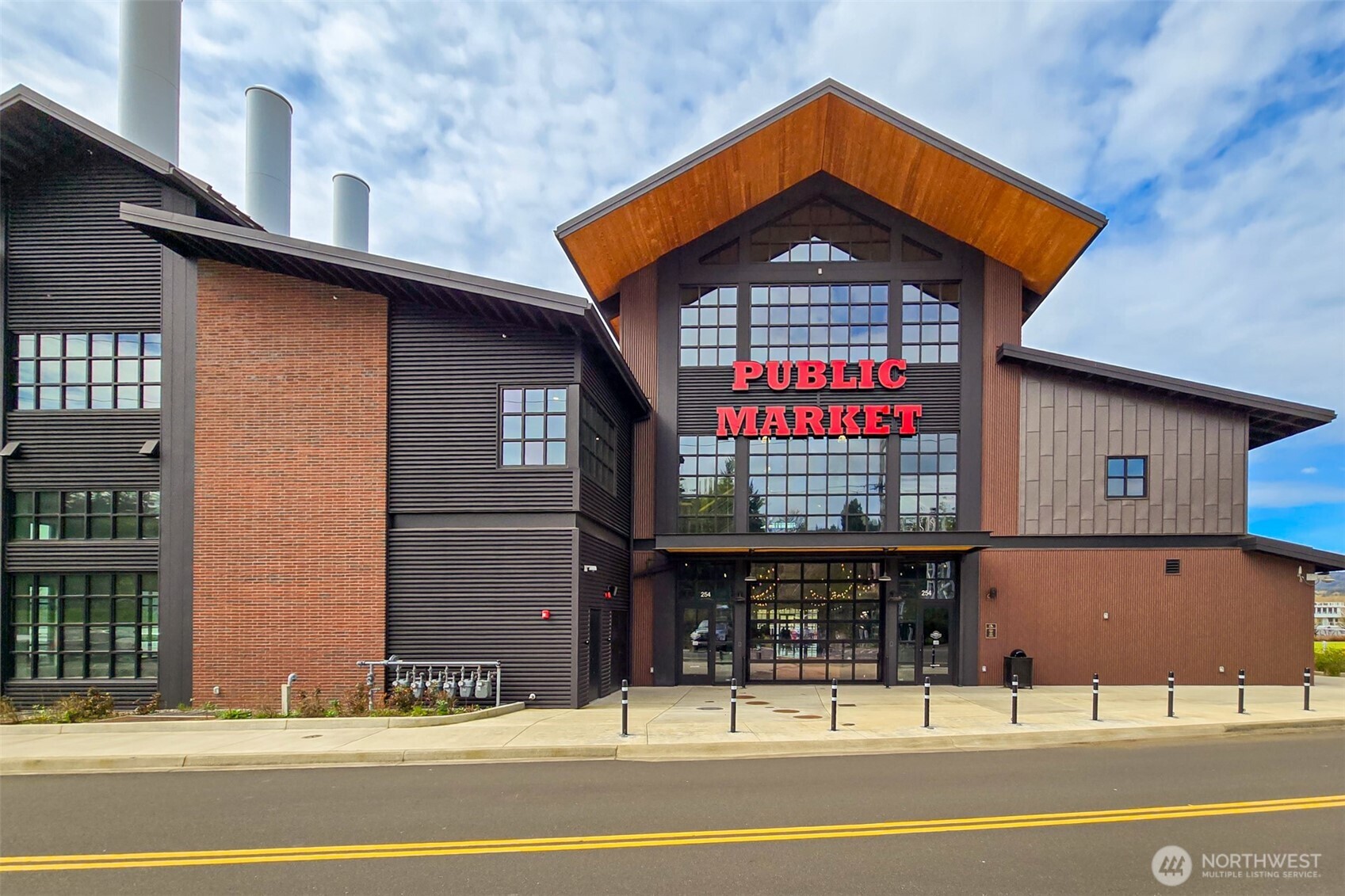 0 Spencer Creek Road, Unit LOT 1 Kalama, WA 98625 - Photo 25 of 31 a front view of a building with street
