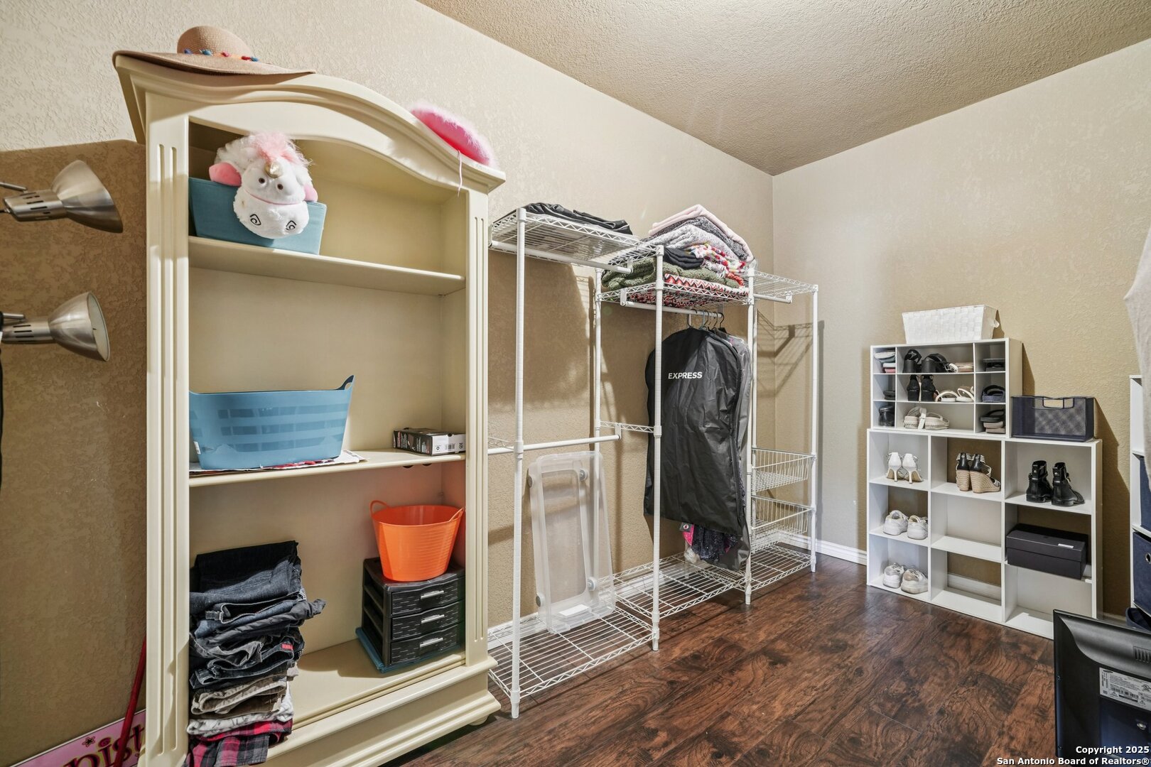 718 Ruidosa Downs Helotes, TX 78023 - Photo 22 of 50 a view of walk in closet with clothes and shoes