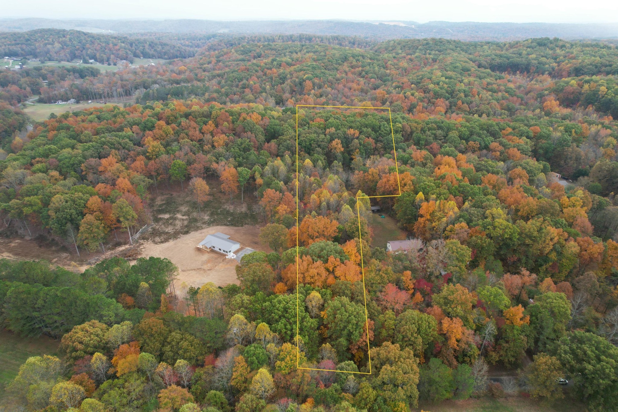 0 County Road 181 Decatur, TN 37322 - Photo 3 of 16 an aerial view of a houses with a lush green hillside